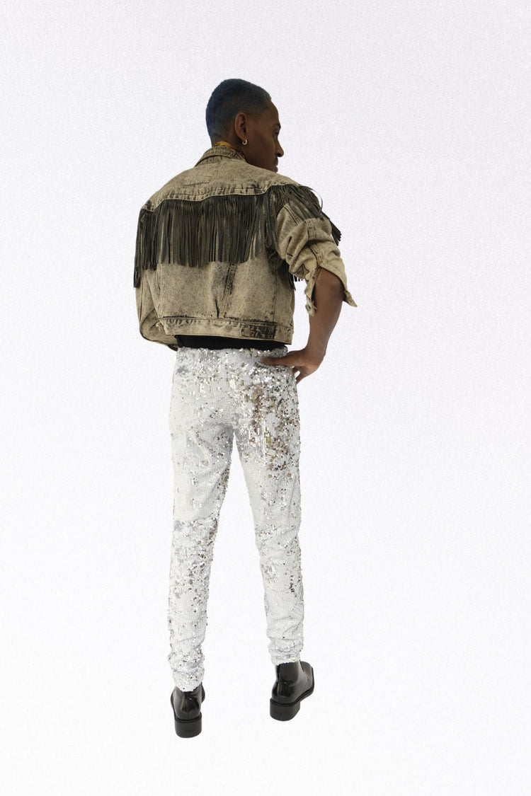 Man wearing white silver sequin pants