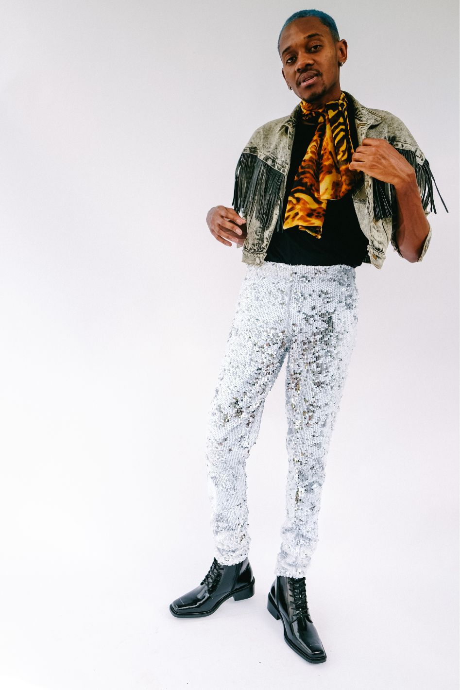Man wearing white silver sequin pants