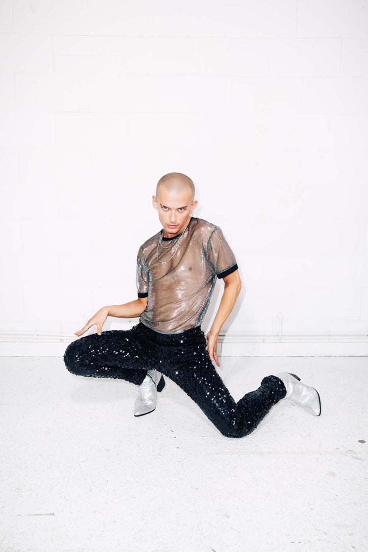 Man wearing sparkly sheer silver T-Shirt