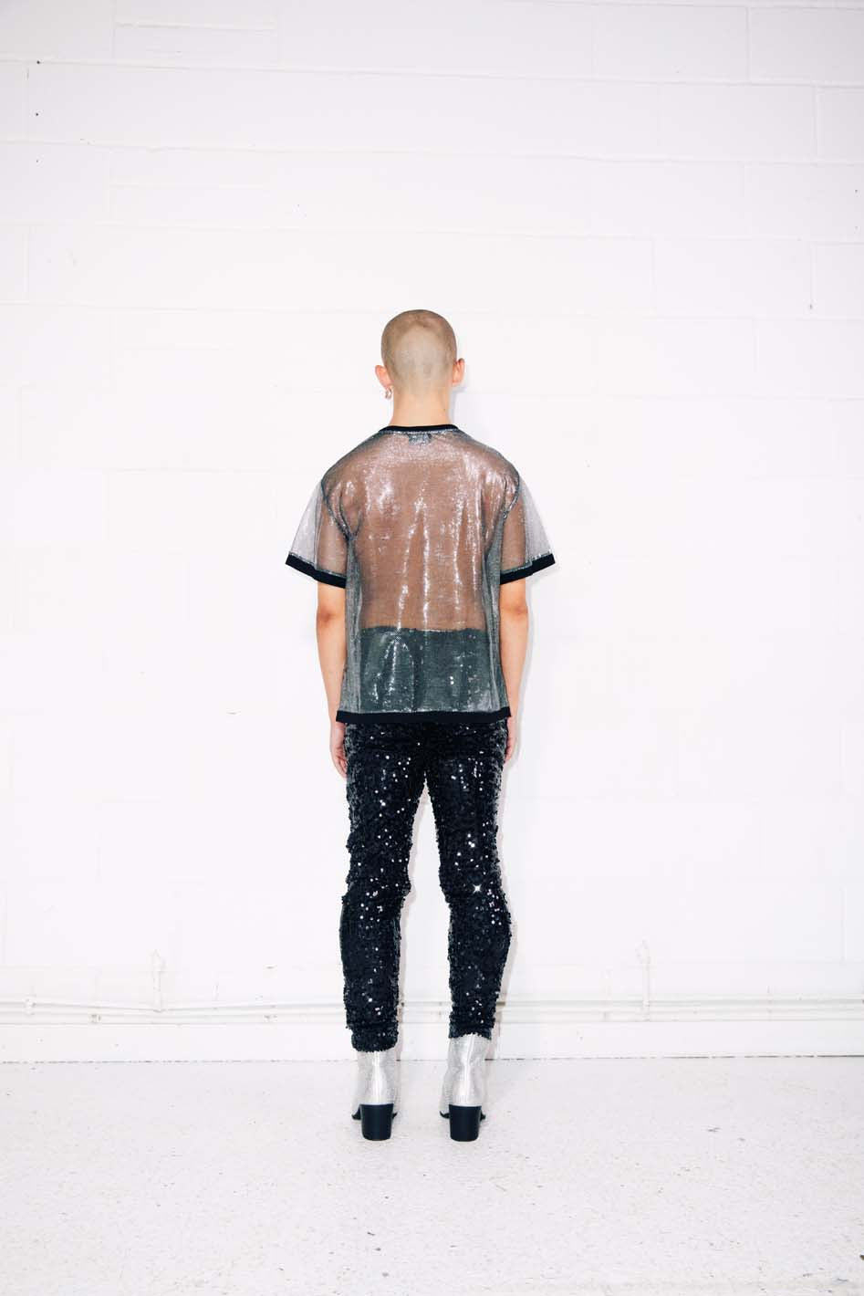 Man wearing sparkly sheer silver T-Shirt