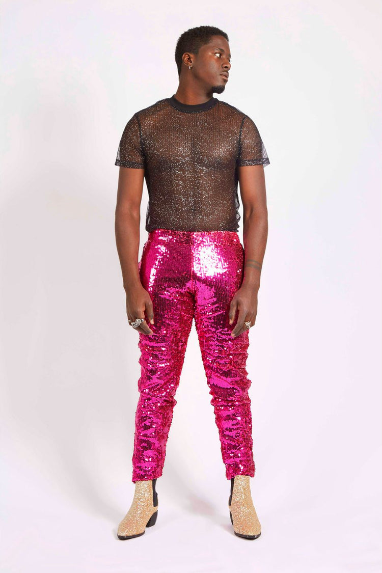 Man wearing pink sequin pants