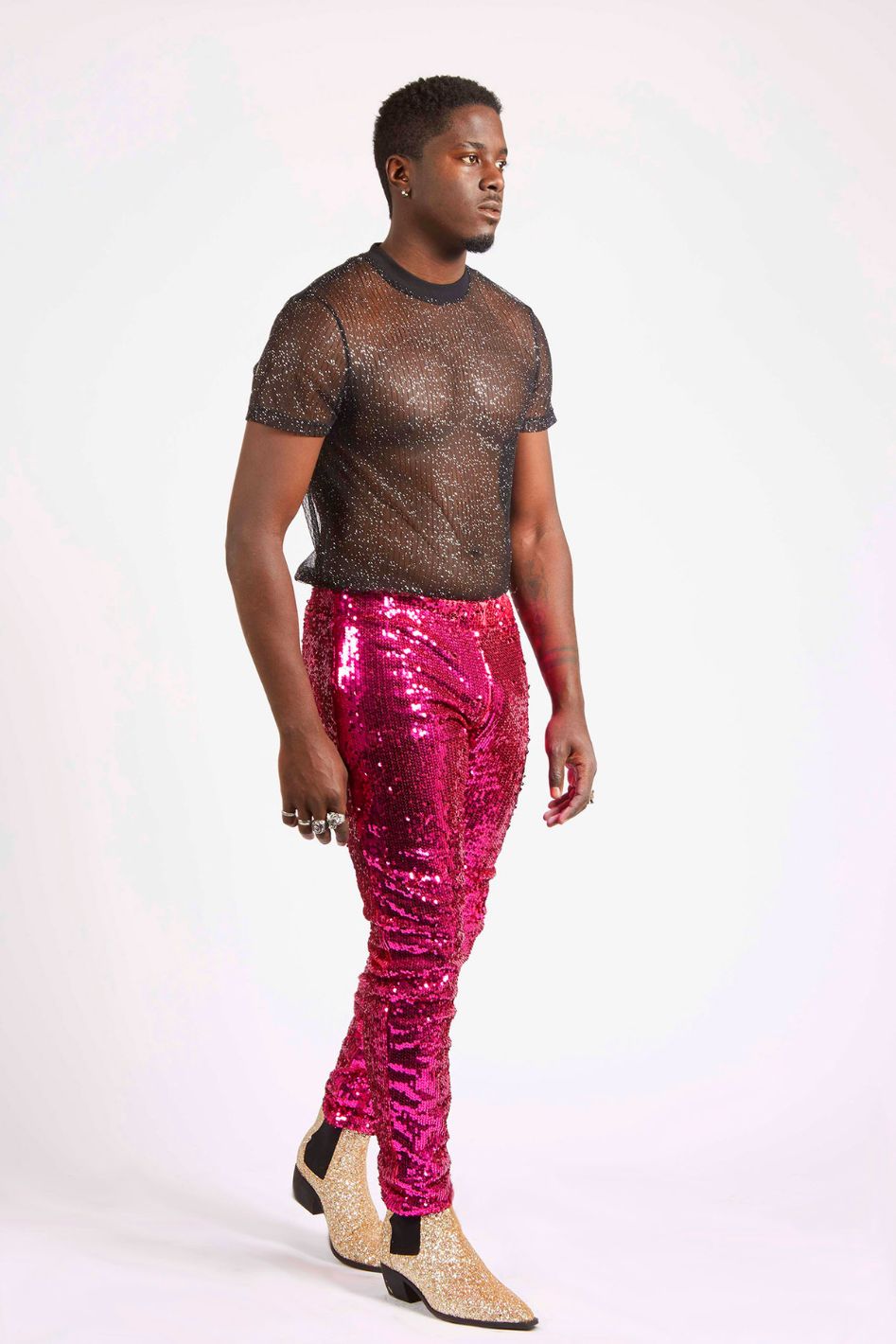 Man wearing pink sequin pants