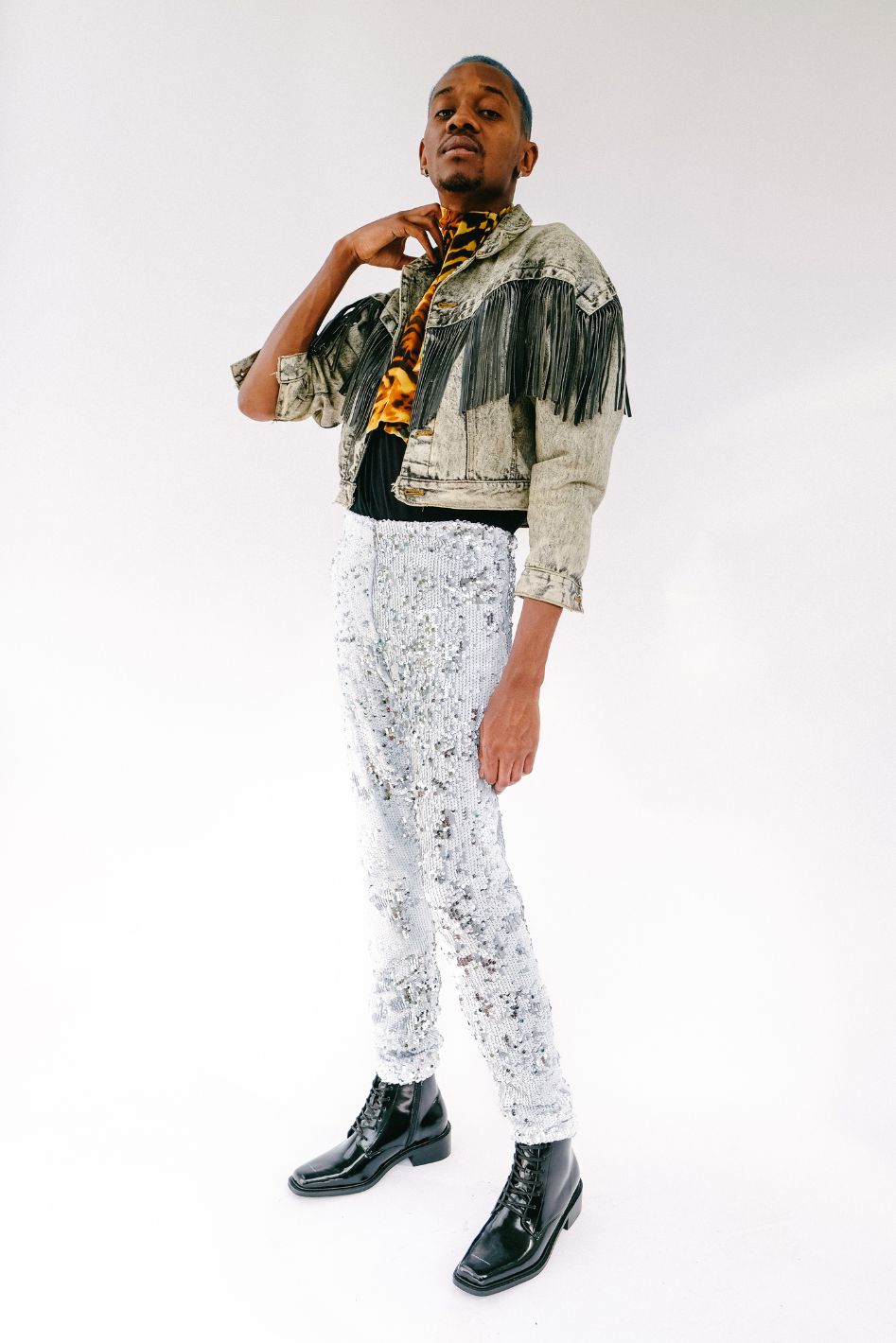 Man wearing white silver sequin pants