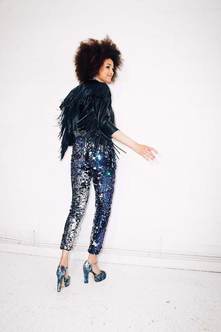 Woman wearing blue silver sequin pants