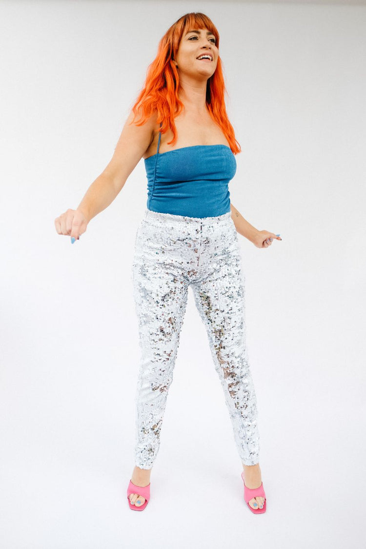 Women wearing white silver sequin pants