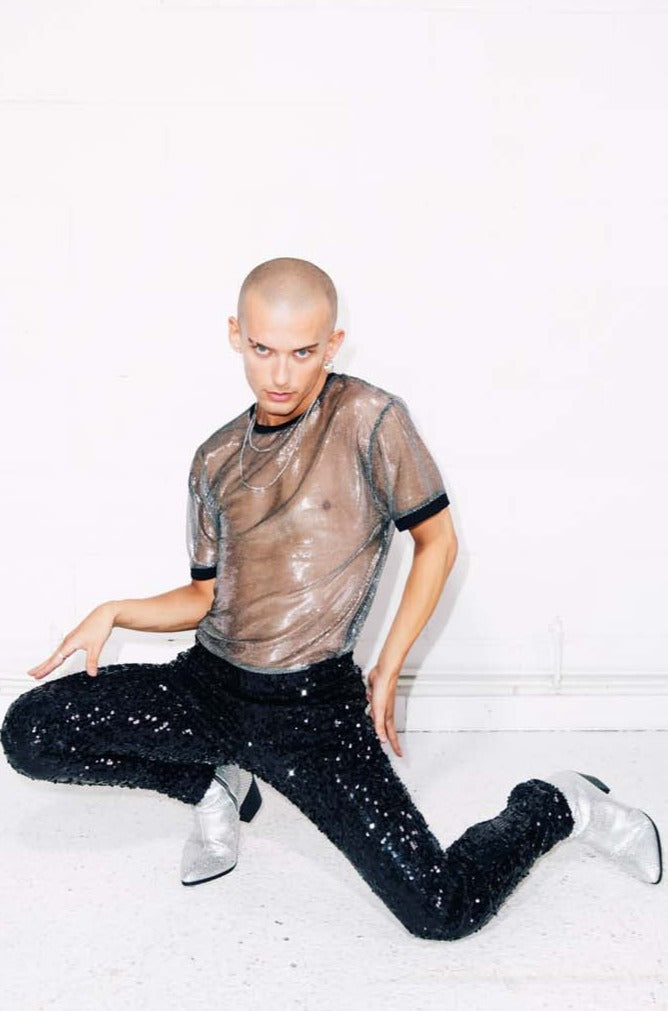 Man wearing sheer silver T-Shirt