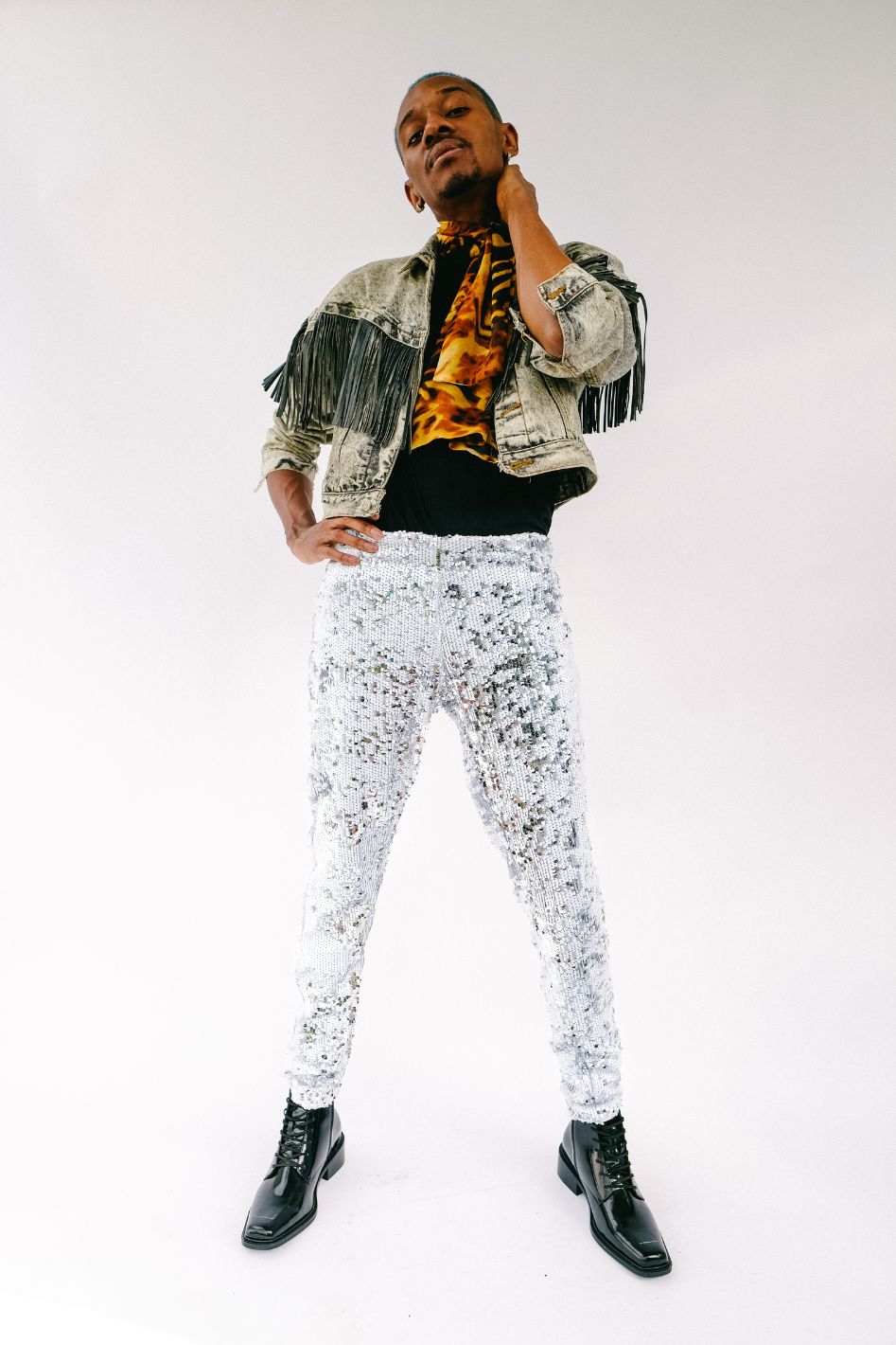 Man wearing white silver sequin pants